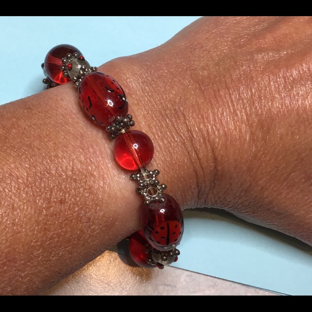 Glass beaded bracelet with ladybug motif